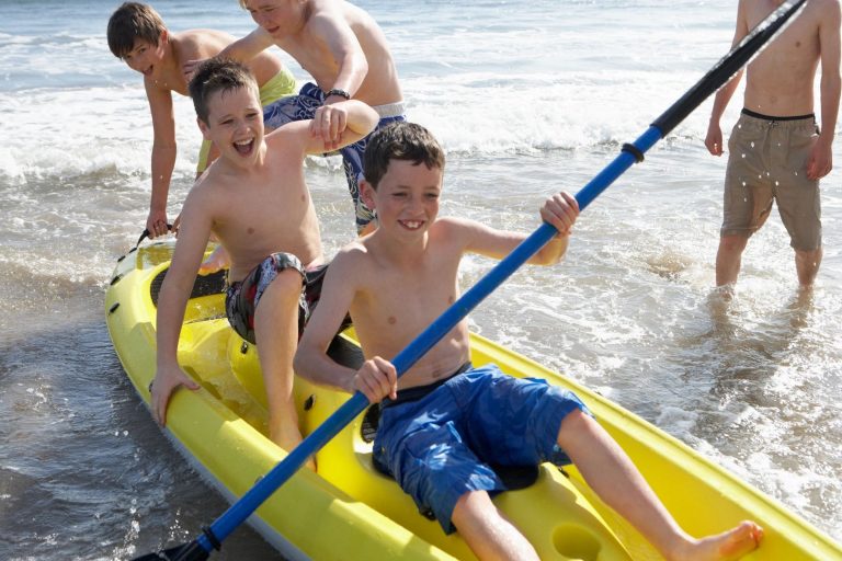 Kids Paddling Canoe